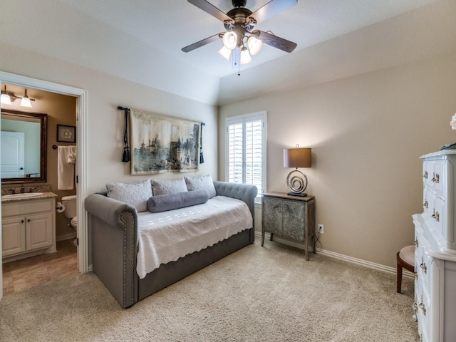 656 Clearwater Dr, Irving, TX 75039 - bedroom with light carpet, a sink, baseboards, and ensuite bathroom