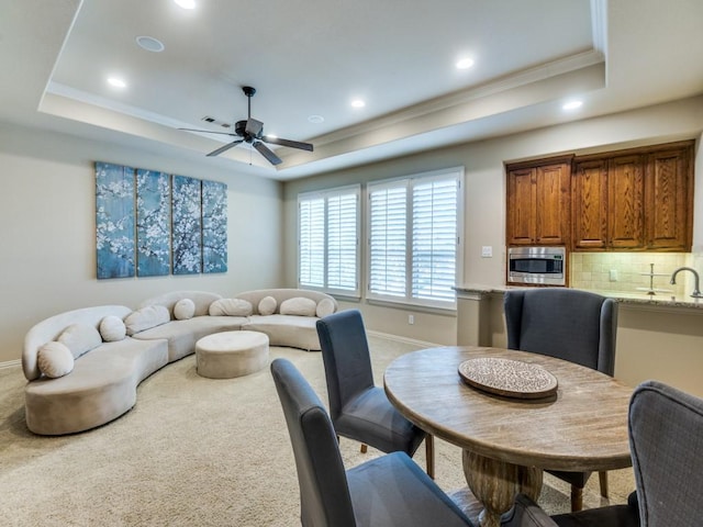 656 Clearwater Dr, Irving, TX 75039 - carpeted dining area with a raised ceiling, a ceiling fan, baseboards, crown molding, and recessed lighting