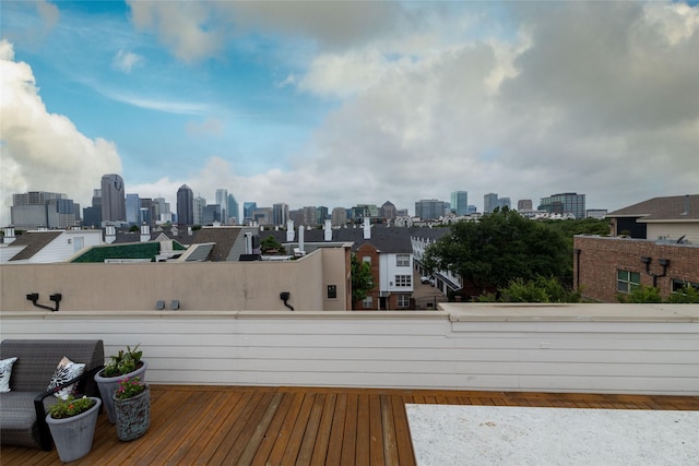 2411 N Hall St Unit 40, Dallas, TX 75204 - wooden terrace with a skyline view