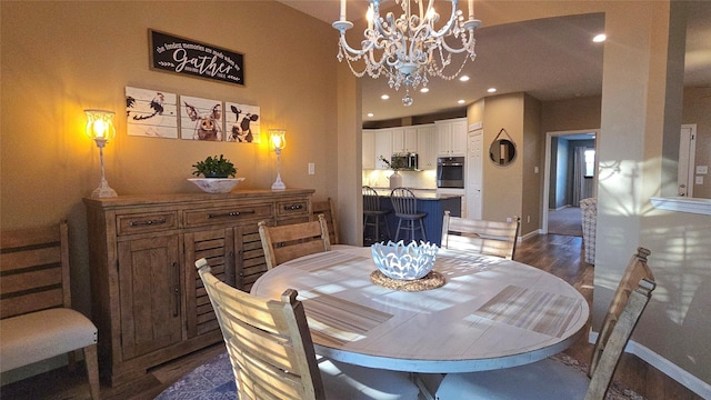 504 Greenwood Ln, Krum, TX 76249 - dining area featuring a chandelier, dark wood-style floors, recessed lighting, and baseboards
