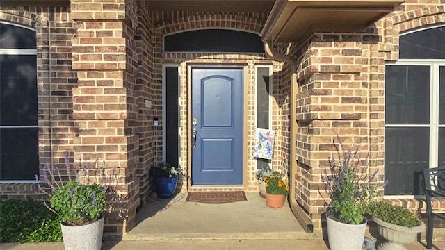 504 Greenwood Ln, Krum, TX 76249 - doorway to property featuring brick siding