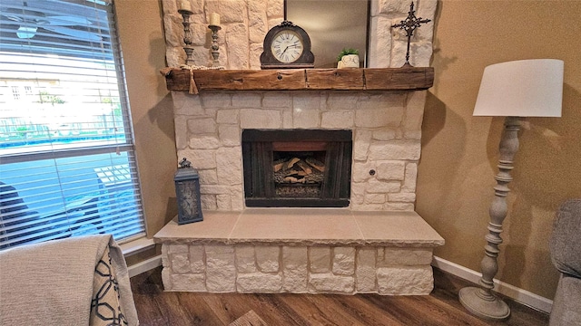 504 Greenwood Ln, Krum, TX 76249 - detailed view of wood finished floors, baseboards, and a stone fireplace