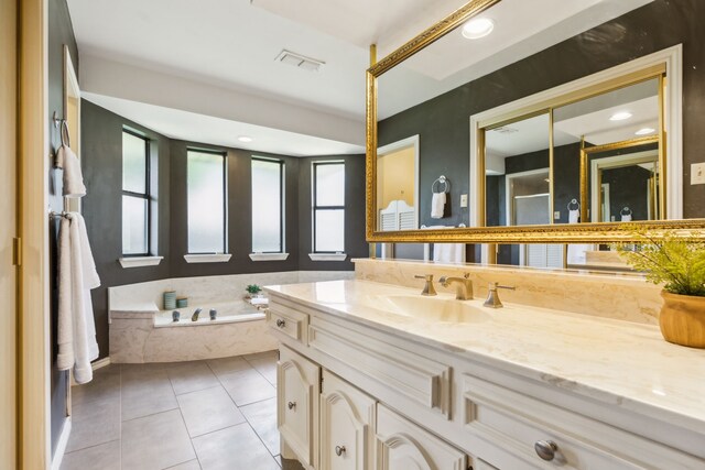4130 High Star Ln, Dallas, TX 75287 - bathroom featuring vanity, a garden tub, and tile patterned flooring