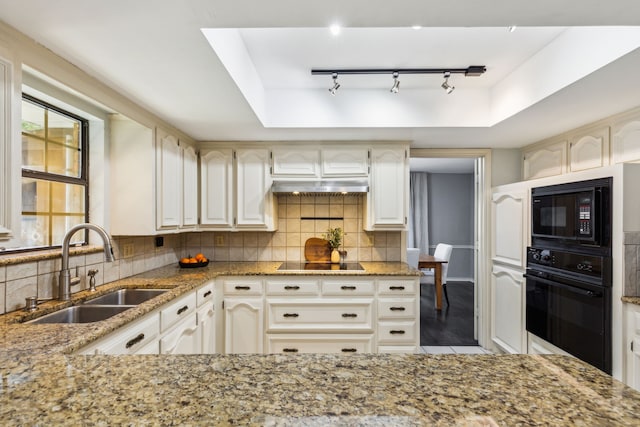 4130 High Star Ln, Dallas, TX 75287 - kitchen with black appliances, a sink, light stone counters, and decorative backsplash