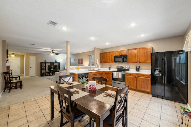2104 Blanco Ln, Justin, TX 76247 - dining area with ceiling fan, light tile patterned floors, light colored carpet, recessed lighting, and a textured ceiling