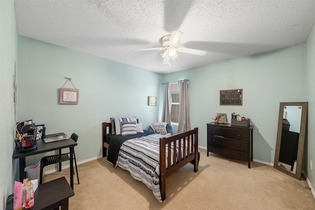 2104 Blanco Ln, Justin, TX 76247 - bedroom with light carpet, ceiling fan, baseboards, and a textured ceiling