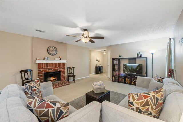 2104 Blanco Ln, Justin, TX 76247 - living area with a ceiling fan, carpet flooring, a fireplace, baseboards, and a textured ceiling