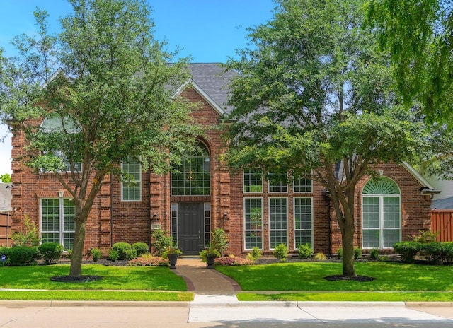 5617 Lindsey Dr, Plano, TX 75093 - view of front of house featuring a front lawn and brick siding