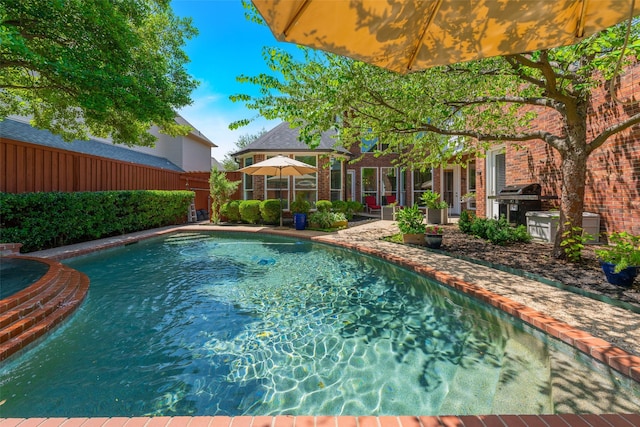 5617 Lindsey Dr, Plano, TX 75093 - view of swimming pool featuring a fenced backyard and area for grilling
