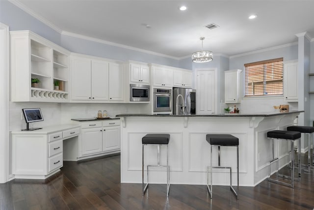 5617 Lindsey Dr, Plano, TX 75093 - kitchen featuring stainless steel appliances, open shelves, white cabinets, a breakfast bar, and recessed lighting