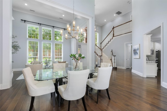 5617 Lindsey Dr, Plano, TX 75093 - dining space with baseboards, a high ceiling, a chandelier, dark wood finished floors, and stairway