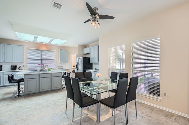 631 Ridgemont Dr, Allen, TX 75002 - dining area featuring a skylight and ceiling fan