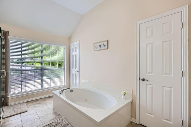 631 Ridgemont Dr, Allen, TX 75002 - bathroom featuring lofted ceiling, a tub with jets, plenty of natural light, and tile patterned floors
