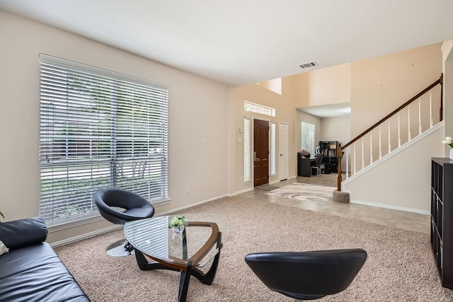 631 Ridgemont Dr, Allen, TX 75002 - living area with healthy amount of natural light, stairway, and baseboards