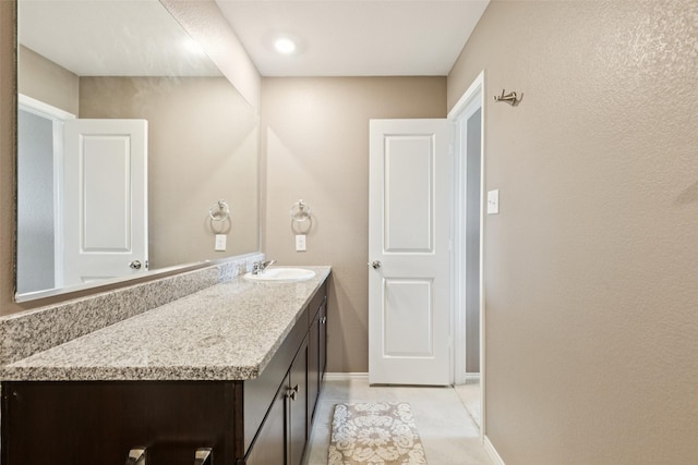 1713 Claireborne Ct, Little Elm, TX 75068 - bathroom featuring vanity and baseboards