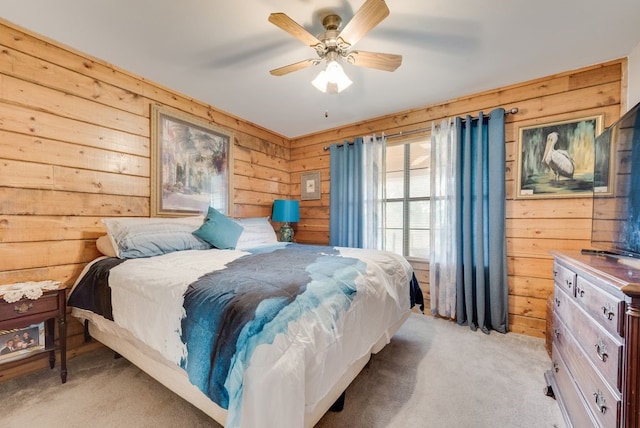 14213 Clark Dr, Streetman, TX 75859 - bedroom featuring wood walls, light colored carpet, and a ceiling fan