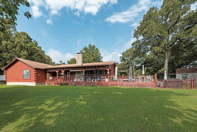 14213 Clark Dr, Streetman, TX 75859 - rear view of house with log exterior, a chimney, and a wooden deck