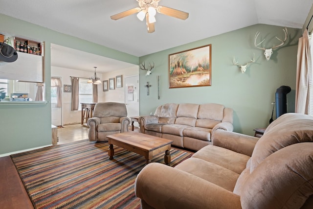 1105 Ashwood Ct, Cleburne, TX 76033 - living area featuring wood finished floors, a ceiling fan, and vaulted ceiling