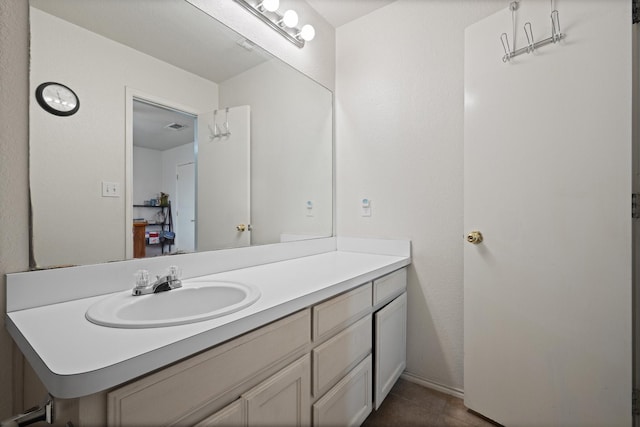 1105 Ashwood Ct, Cleburne, TX 76033 - bathroom with vanity and tile patterned floors