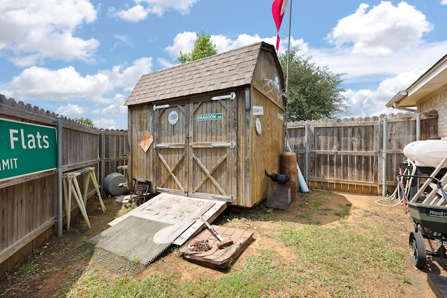 1105 Ashwood Ct, Cleburne, TX 76033 - view of shed featuring a fenced backyard