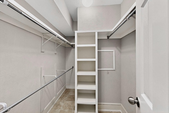7736 Meadow Rd Unit 203, Dallas, TX 75230 - spacious closet with light tile patterned floors