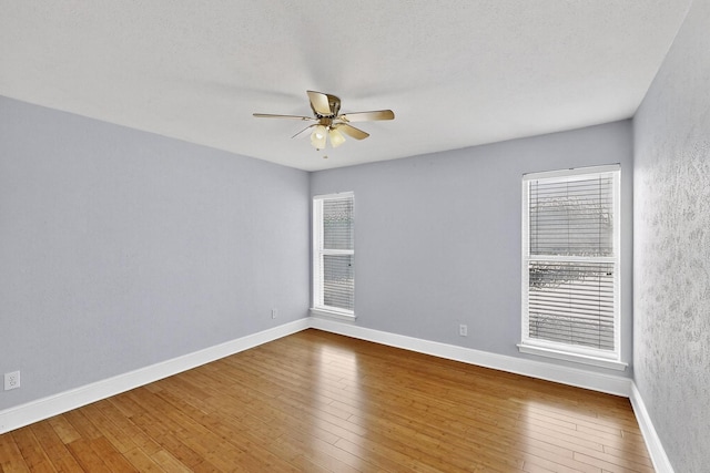 7736 Meadow Rd Unit 203, Dallas, TX 75230 - empty room featuring ceiling fan and hardwood / wood-style flooring
