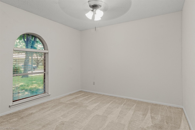 809 Monique, Cedar Hill, TX 75104 - spare room featuring a ceiling fan, light colored carpet, and baseboards