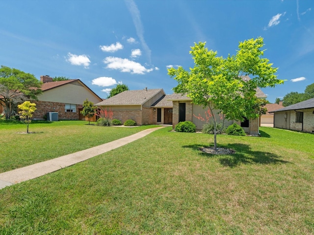 1507 Summertree Ct, Richardson, TX 75082 - single story home featuring a front lawn, brick siding, and central AC