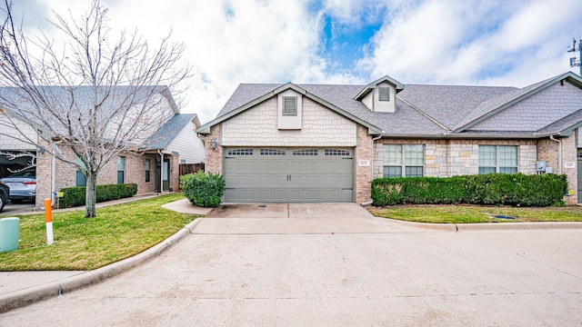 2231 Cobblestone Ct, Granbury, TX 76049 - view of front of home with driveway, a front lawn, a garage, and roof with shingles