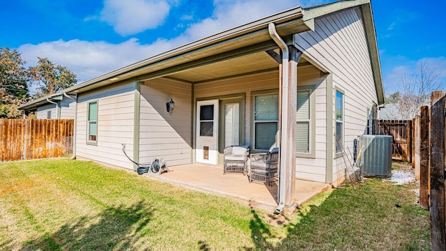 2231 Cobblestone Ct, Granbury, TX 76049 - back of house featuring central AC unit and a patio