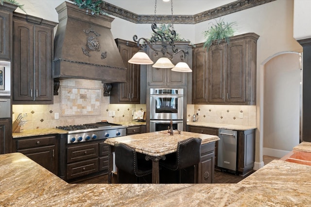 1608 Rivercrest Ct, Fort Worth, TX 76107 - kitchen featuring custom exhaust hood, stainless steel appliances, and dark brown cabinets