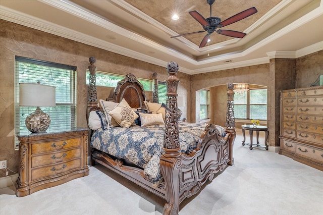 1608 Rivercrest Ct, Fort Worth, TX 76107 - bedroom with crown molding, light carpet, a tray ceiling, arched walkways, and a ceiling fan