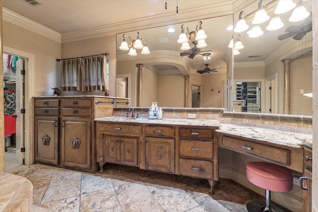 1608 Rivercrest Ct, Fort Worth, TX 76107 - bathroom featuring ceiling fan, vanity, ornate columns, crown molding, and stone tile flooring