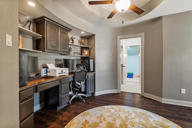 1608 Rivercrest Ct, Fort Worth, TX 76107 - office featuring a textured wall, dark wood-type flooring, built in desk, ceiling fan, and baseboards