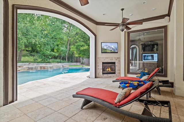 1608 Rivercrest Ct, Fort Worth, TX 76107 - fenced backyard with a tiled fireplace, a patio area, and ceiling fan