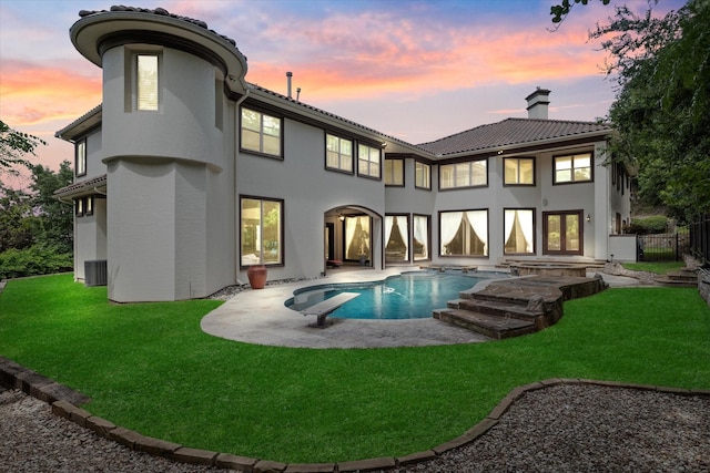 1608 Rivercrest Ct, Fort Worth, TX 76107 - rear view of property featuring a chimney, a patio area, stucco siding, an outdoor pool, and a tiled roof