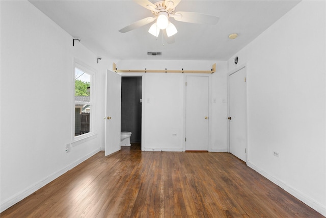 3819 Hubby Ave, Waco, TX 76710 - unfurnished bedroom with wood finished floors, baseboards, and ceiling fan