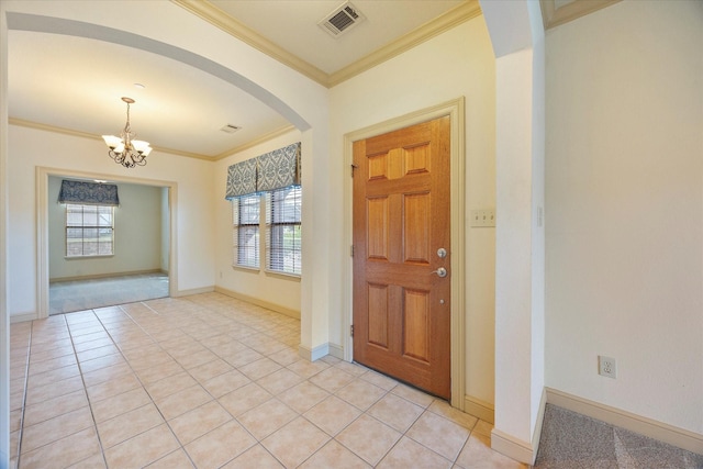 1891 Signal Ridge Pl, Rockwall, TX 75032 - foyer featuring plenty of natural light, a chandelier, crown molding, arched walkways, and light tile patterned floors
