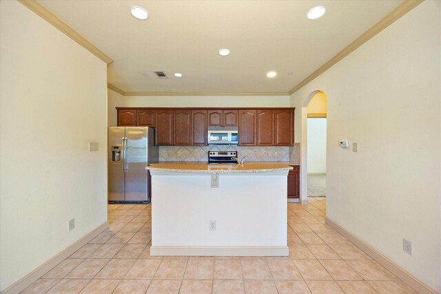 1891 Signal Ridge Pl, Rockwall, TX 75032 - kitchen featuring stainless steel fridge with ice dispenser, range with electric stovetop, ornamental molding, arched walkways, and baseboards