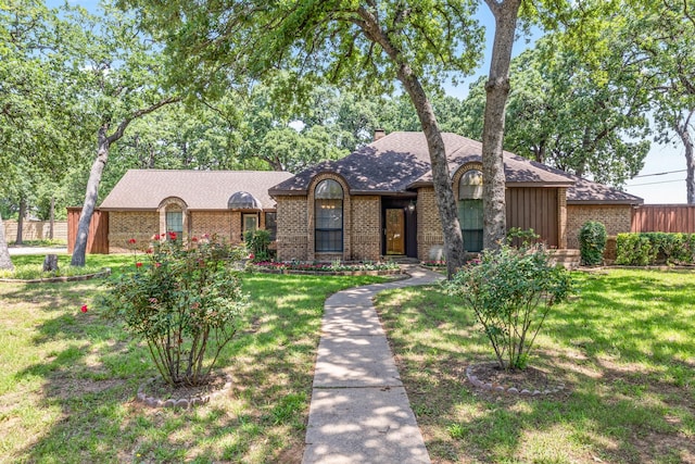 2126 Los Robles St, Grapevine, TX 76051 - view of front of home featuring brick siding, a shingled roof, and a chimney