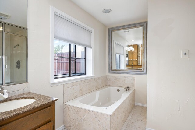 2126 Los Robles St, Grapevine, TX 76051 - bathroom featuring a whirlpool tub, vanity, a shower with door, and tile patterned floors
