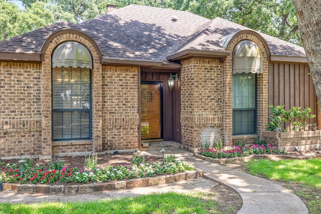 2126 Los Robles St, Grapevine, TX 76051 - view of front of home with brick siding, a shingled roof, a chimney, and board and batten siding