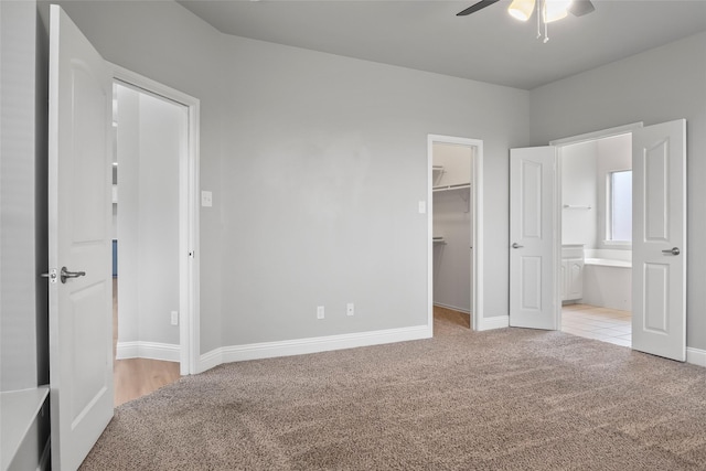 10833 Hawks Landing Rd, Fort Worth, TX 76052 - unfurnished bedroom with carpet, a walk in closet, ensuite bath, and baseboards