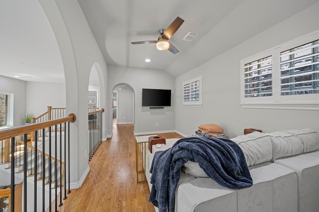 232 Skystone Dr, Irving, TX 75038 - living room with arched walkways, light wood-type flooring, baseboards, a ceiling fan, and recessed lighting