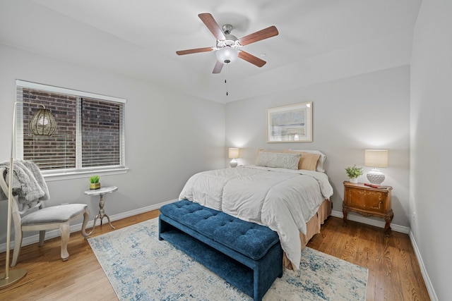232 Skystone Dr, Irving, TX 75038 - bedroom with baseboards, light wood-style floors, and ceiling fan