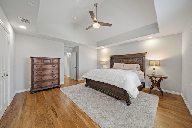 232 Skystone Dr, Irving, TX 75038 - bedroom with wood finished floors, lofted ceiling, baseboards, ceiling fan, and recessed lighting