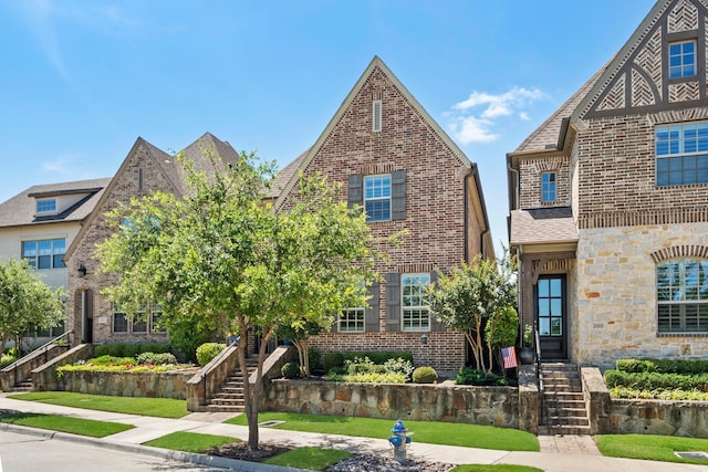 232 Skystone Dr, Irving, TX 75038 - tudor home featuring brick siding and stairs