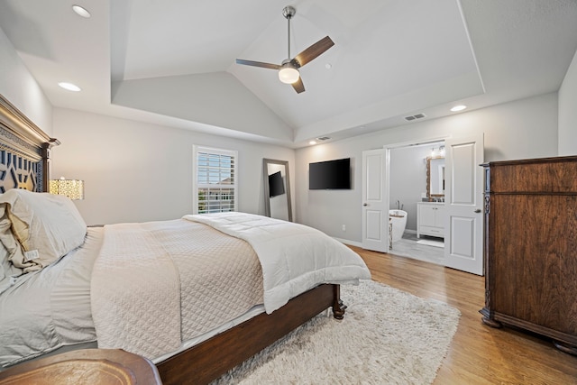 232 Skystone Dr, Irving, TX 75038 - bedroom with vaulted ceiling, light wood-style flooring, ensuite bath, ceiling fan, and recessed lighting