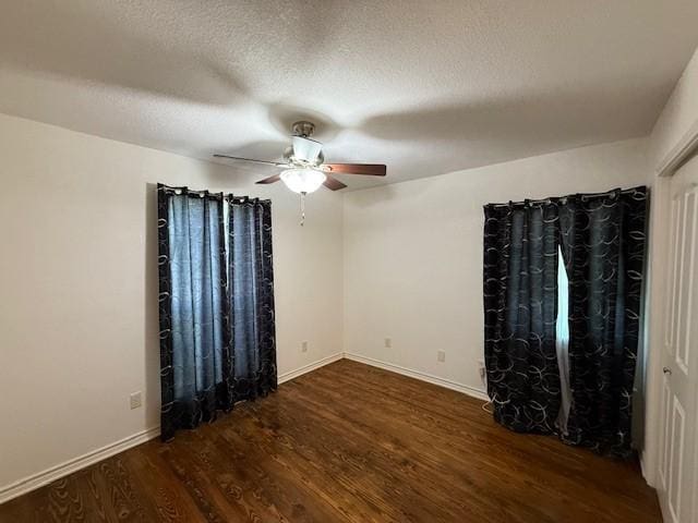 511 W Bonham Ave, Cooper, TX 75432 - unfurnished room with wood finished floors, a ceiling fan, baseboards, and a textured ceiling