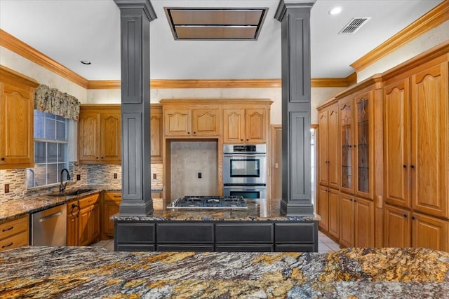 3633 Cliff View Loop, Weatherford, TX 76087 - kitchen featuring ornate columns, appliances with stainless steel finishes, dark stone countertops, light tile patterned floors, and backsplash